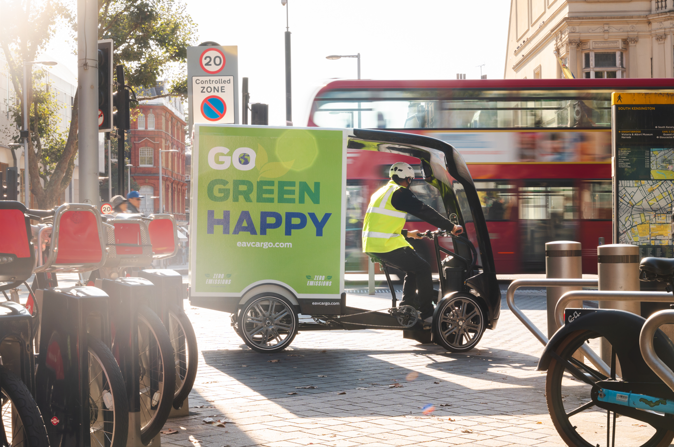 Eav cargo bike in london next to a red bus